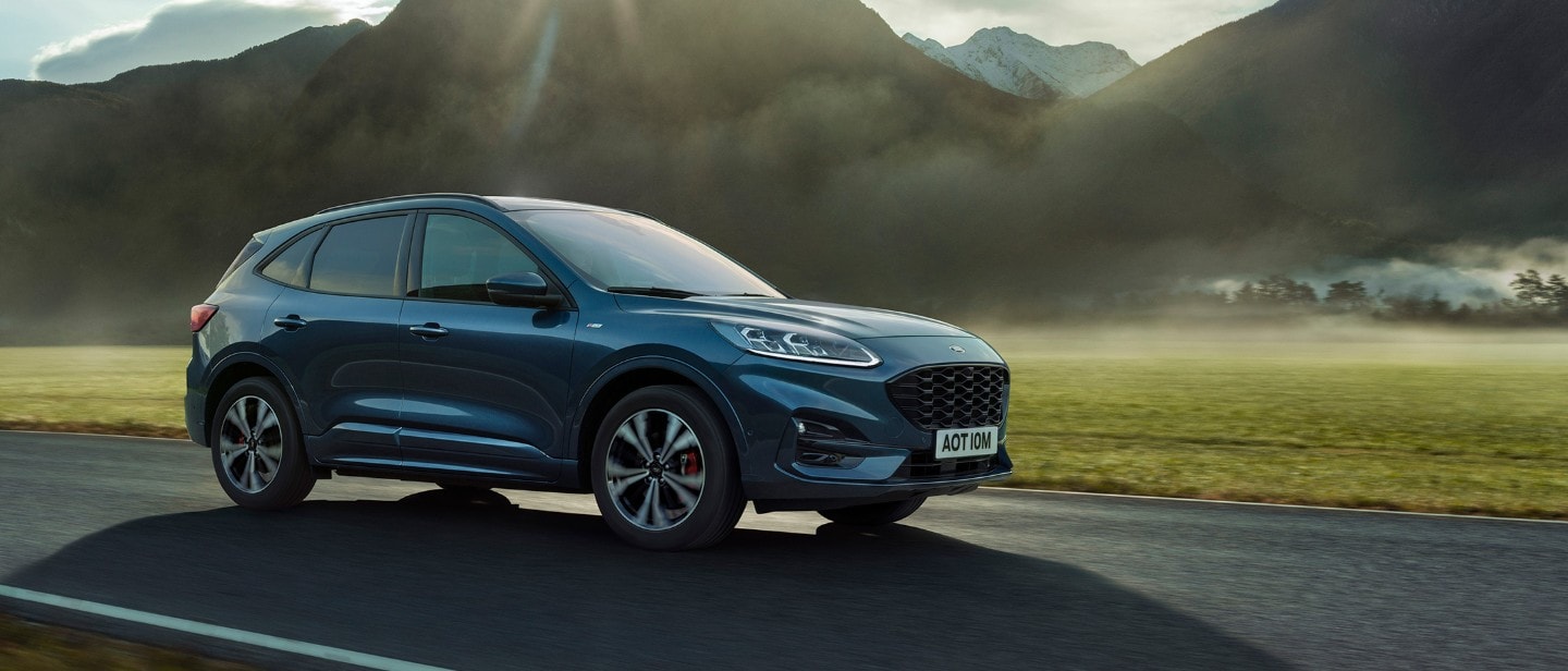 Ford Kuga side view driving by mountain Ford Kuga side view driving by mountain