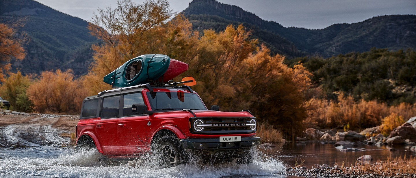 Ford Bronco driving through river Ford Bronco driving through river