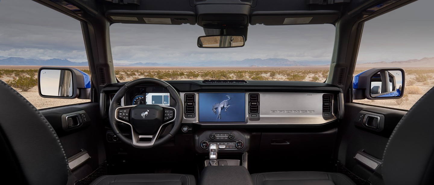 Ford Bronco interior design showing the steering wheel the dashboard and the centre console with 12" touchscreen