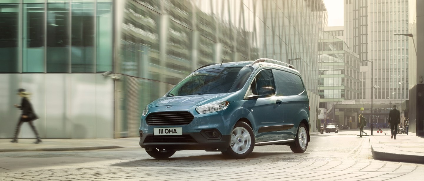 New Ford Transit Courier driving in city street