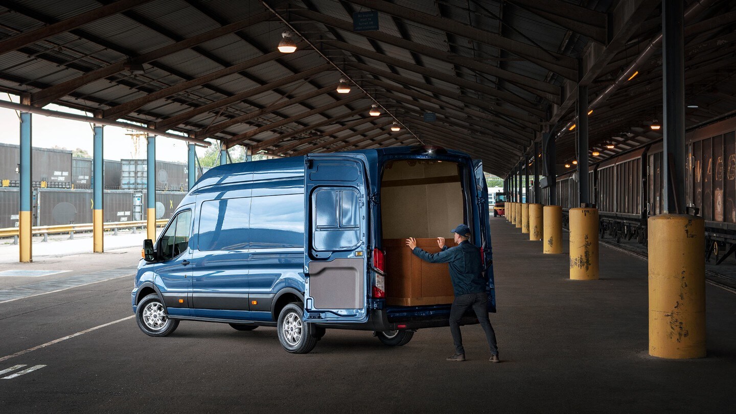 Man loading Transit Van rear view