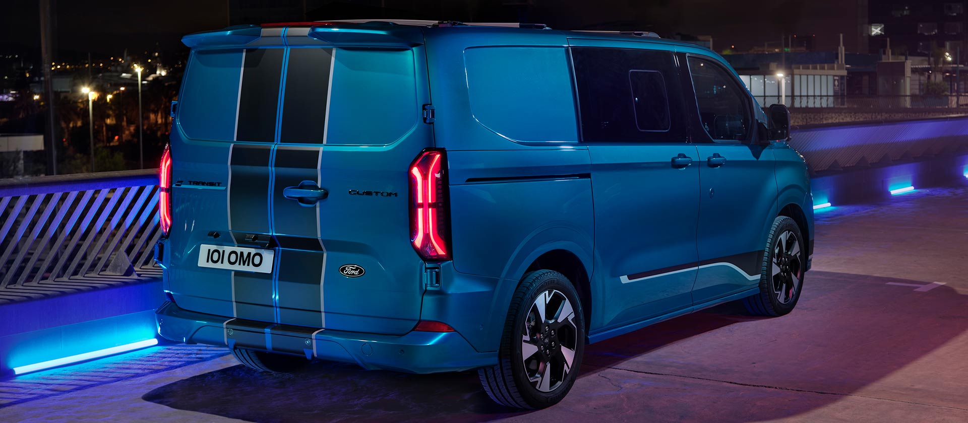 Rear view of blue electric Ford E-Transit Custom Sport Double Cab-in-Van.